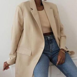 Minimalist cream linen belted jacket from Mango